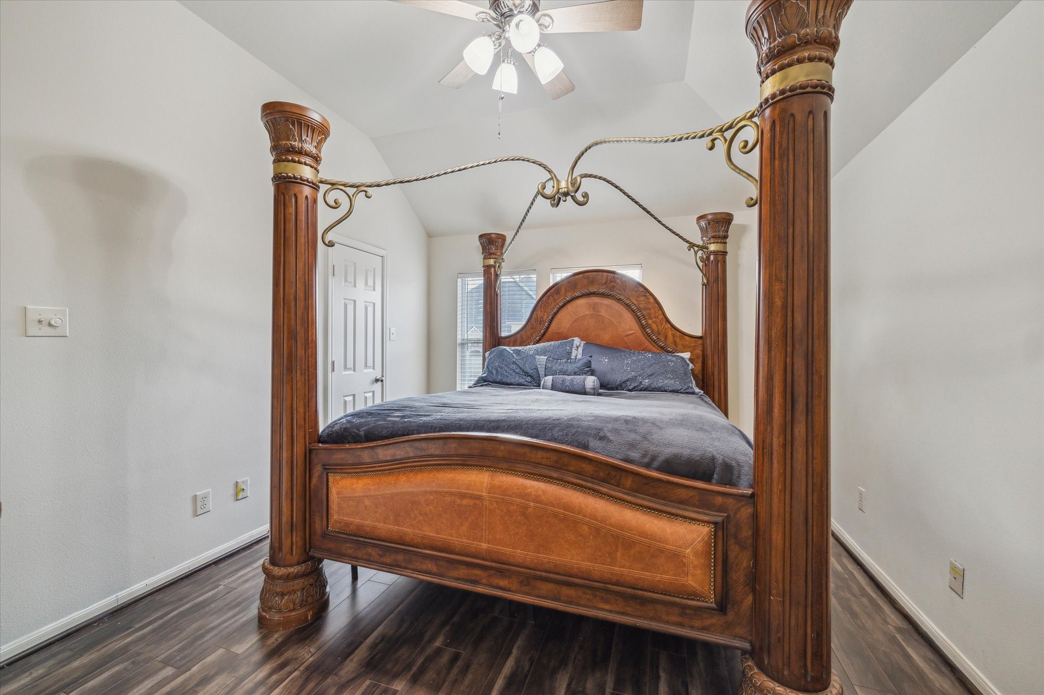 15907 Chart House Court Houston, TX 77044 - Photo 24 of 28 a bedroom with a bed and a dresser with wooden floor