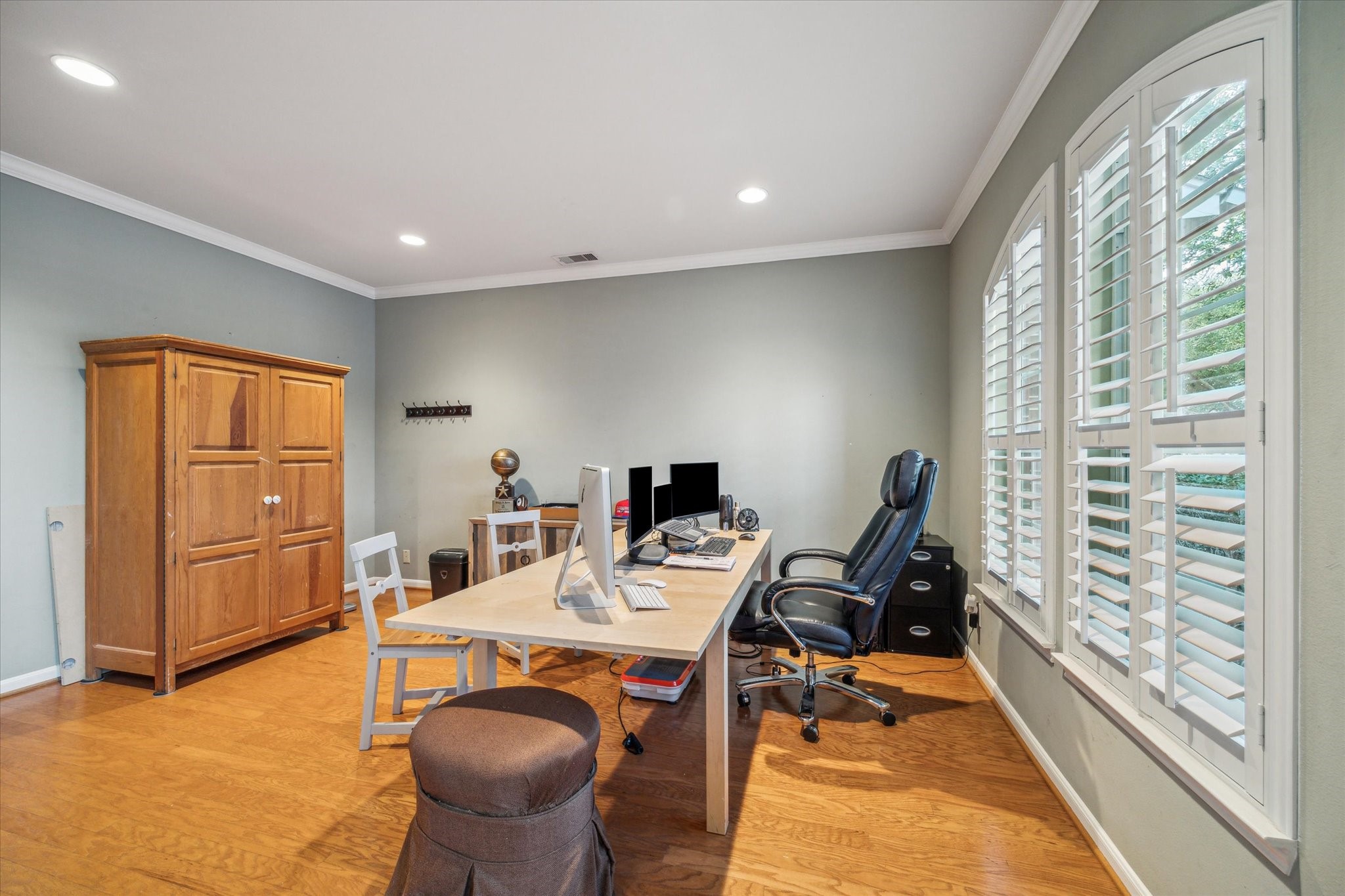 15907 Chart House Court Houston, TX 77044 - Photo 5 of 28 a view of a workspace with furniture and a gate