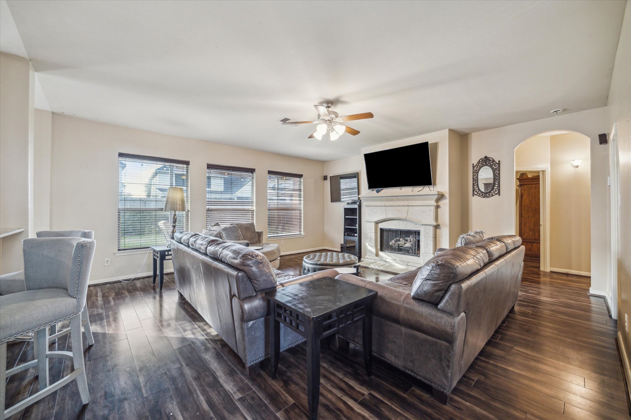 15907 Chart House Court Houston, TX 77044 - Photo 8 of 28 a living room with fireplace furniture and a flat screen tv