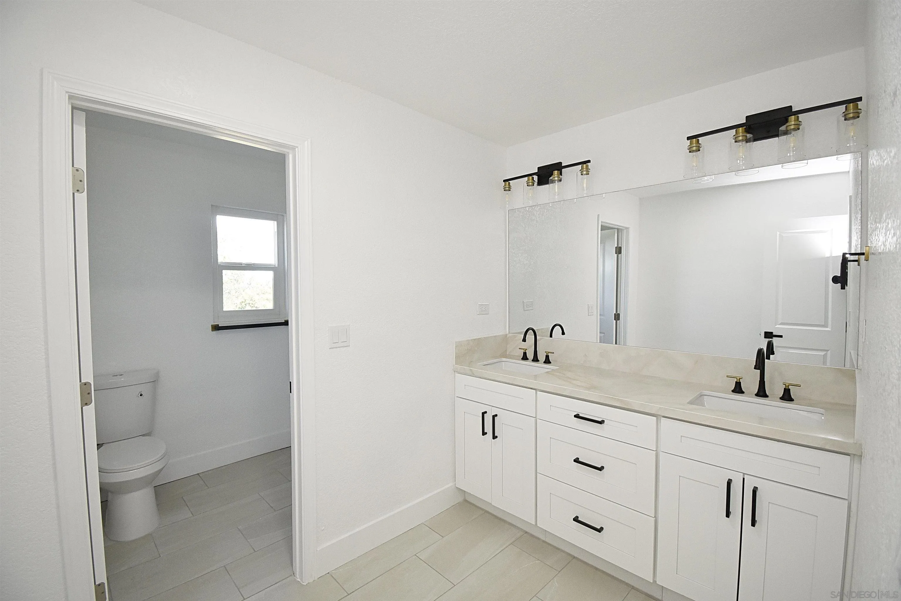 614 Sneath Way Alpine, CA 91901 - Photo 42 of 75 UPSTAIRS HALL BATHROOM WITH DUAL SINKS