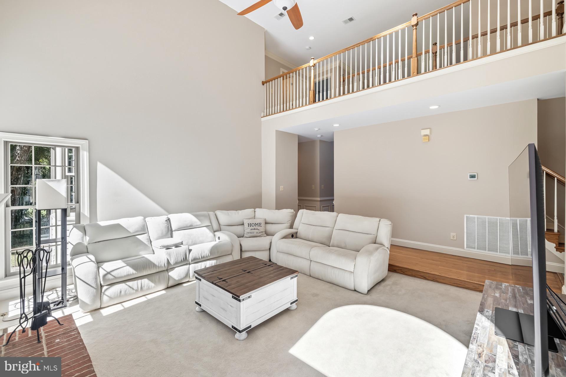 99 Hummingbird Court Dunkirk, MD 20754 - Photo 11 of 82 a living room with furniture and a wooden floor