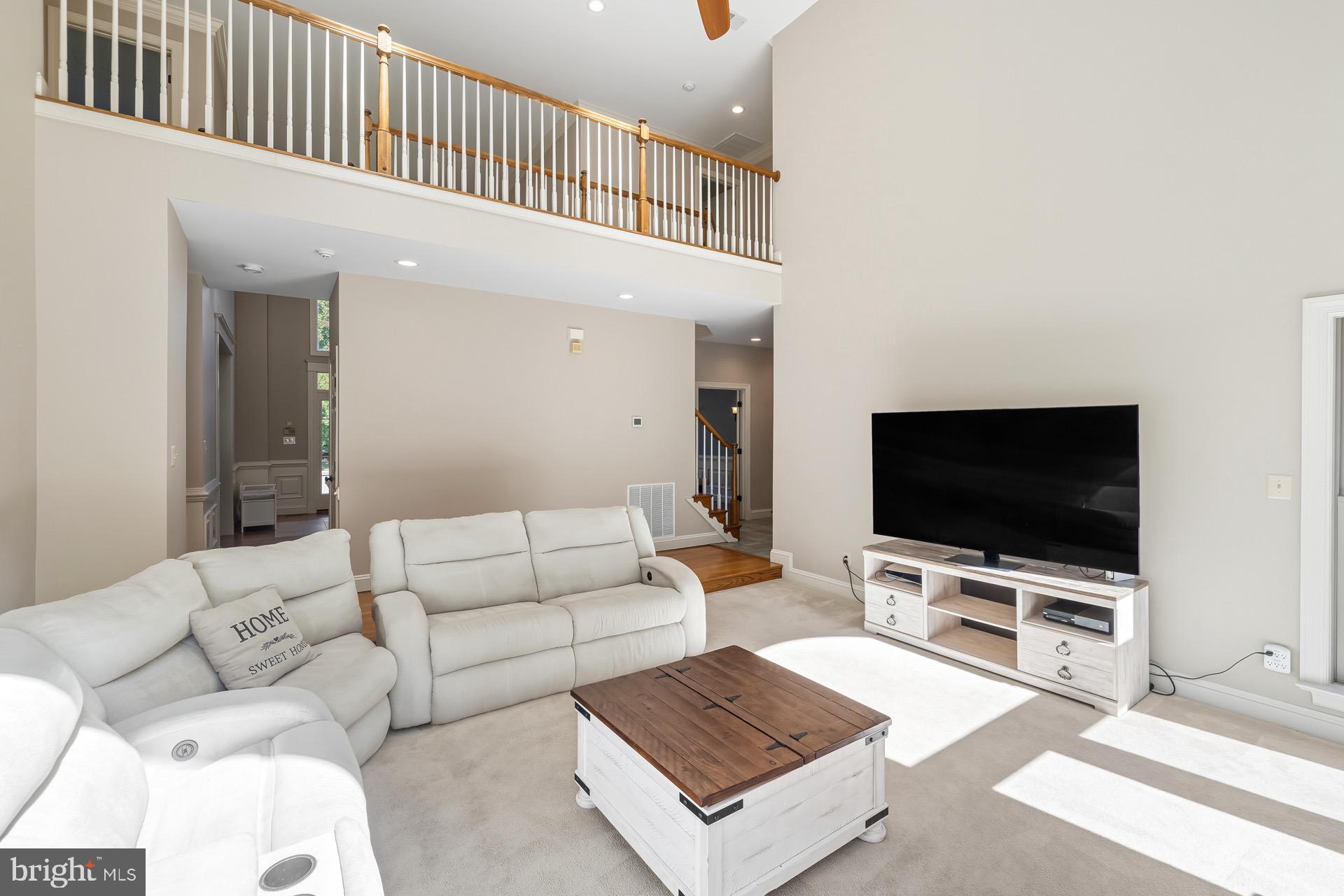 99 Hummingbird Court Dunkirk, MD 20754 - Photo 12 of 82 a living room with furniture and a flat screen tv