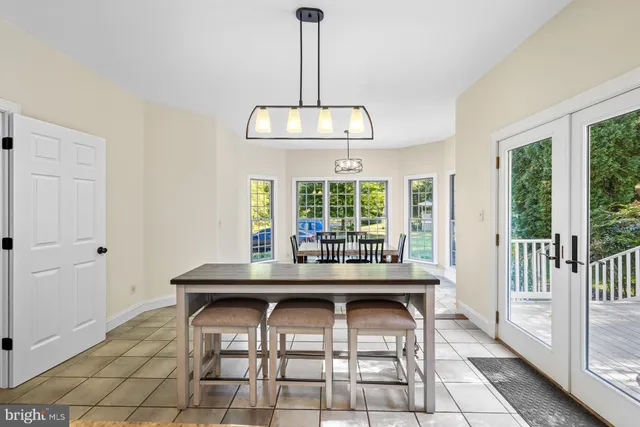 a bedroom with a bed next to a window