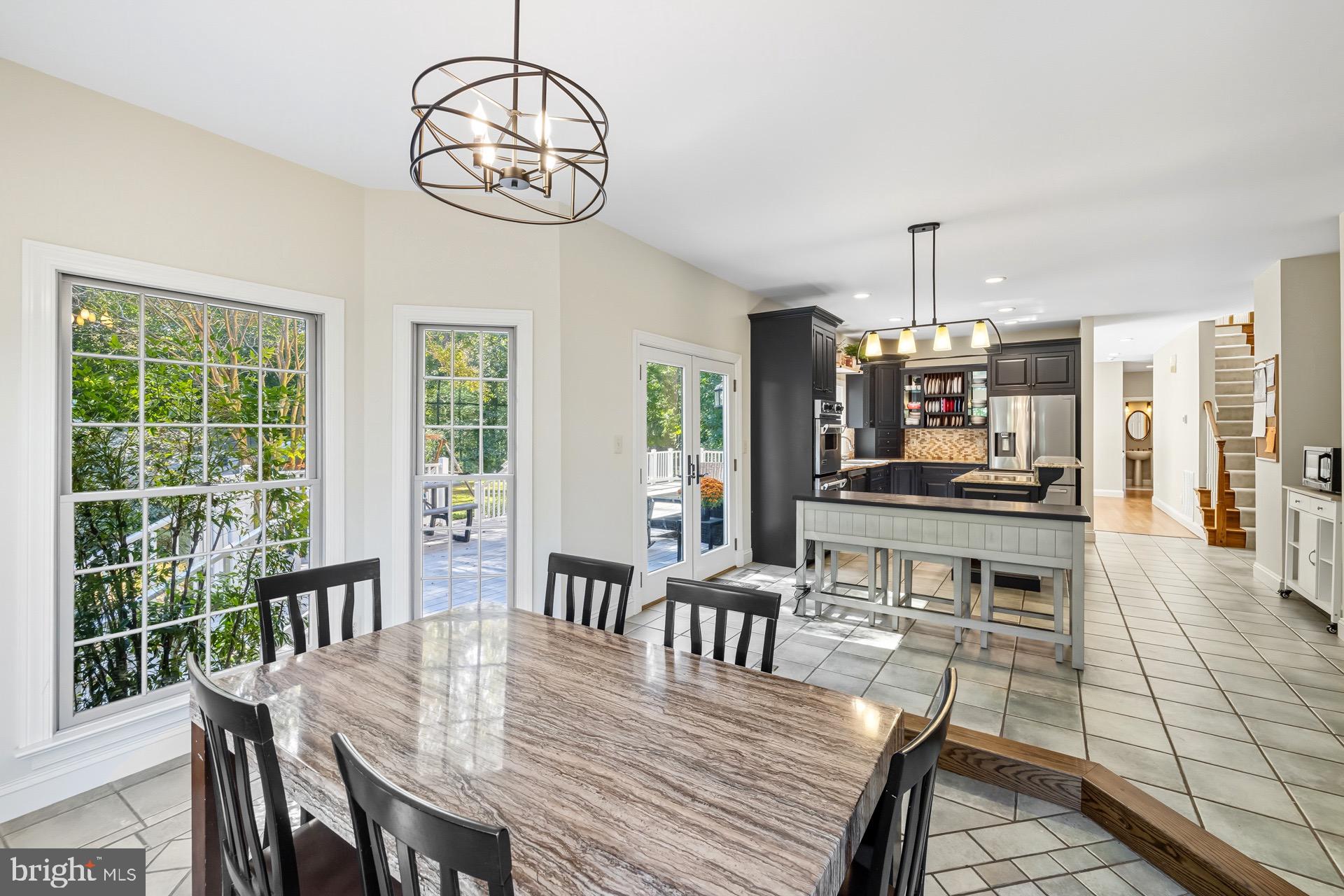 99 Hummingbird Court Dunkirk, MD 20754 - Photo 25 of 82 a view of a dining room with furniture window and wooden floor