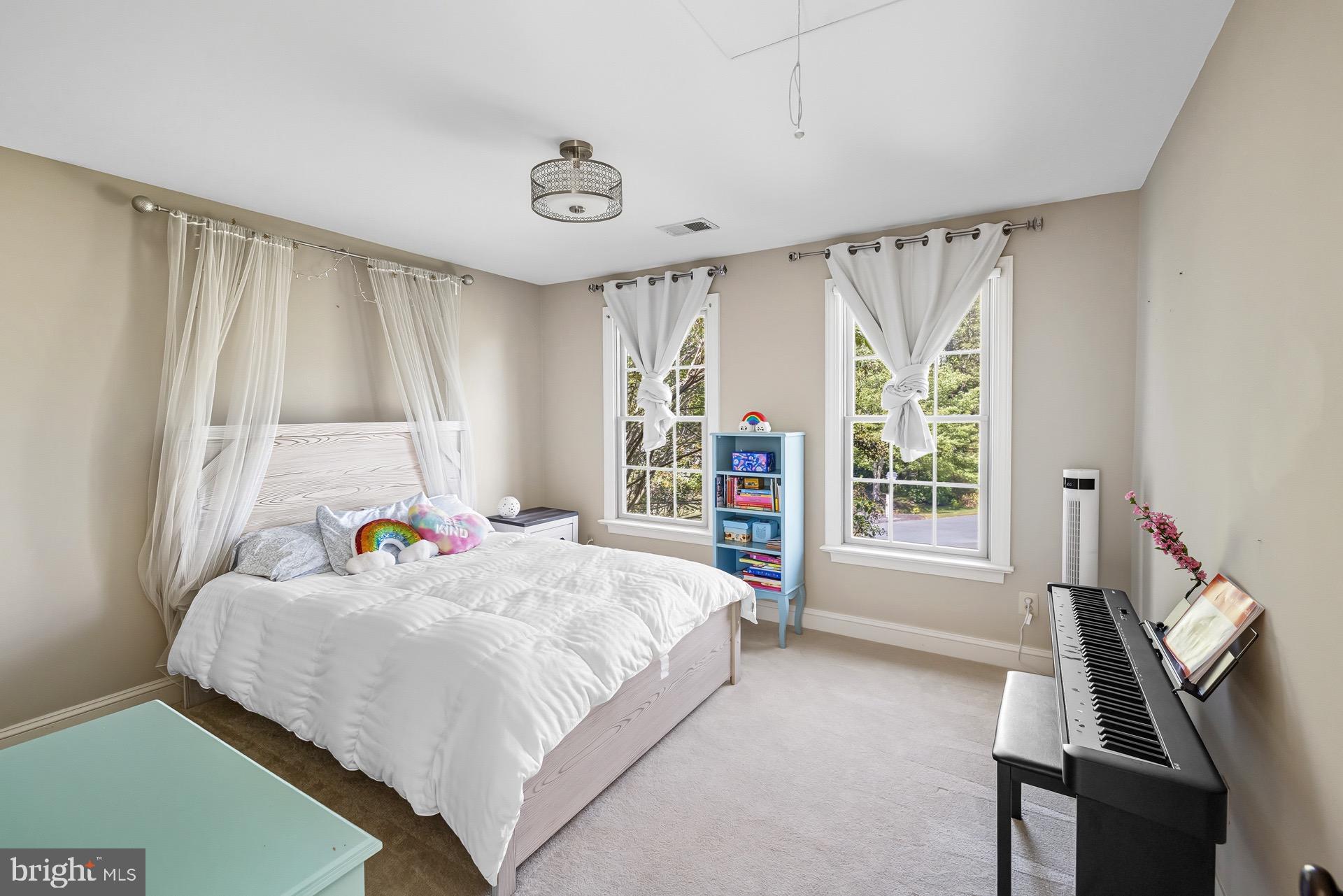 99 Hummingbird Court Dunkirk, MD 20754 - Photo 36 of 82 a bedroom with a bed next to a window