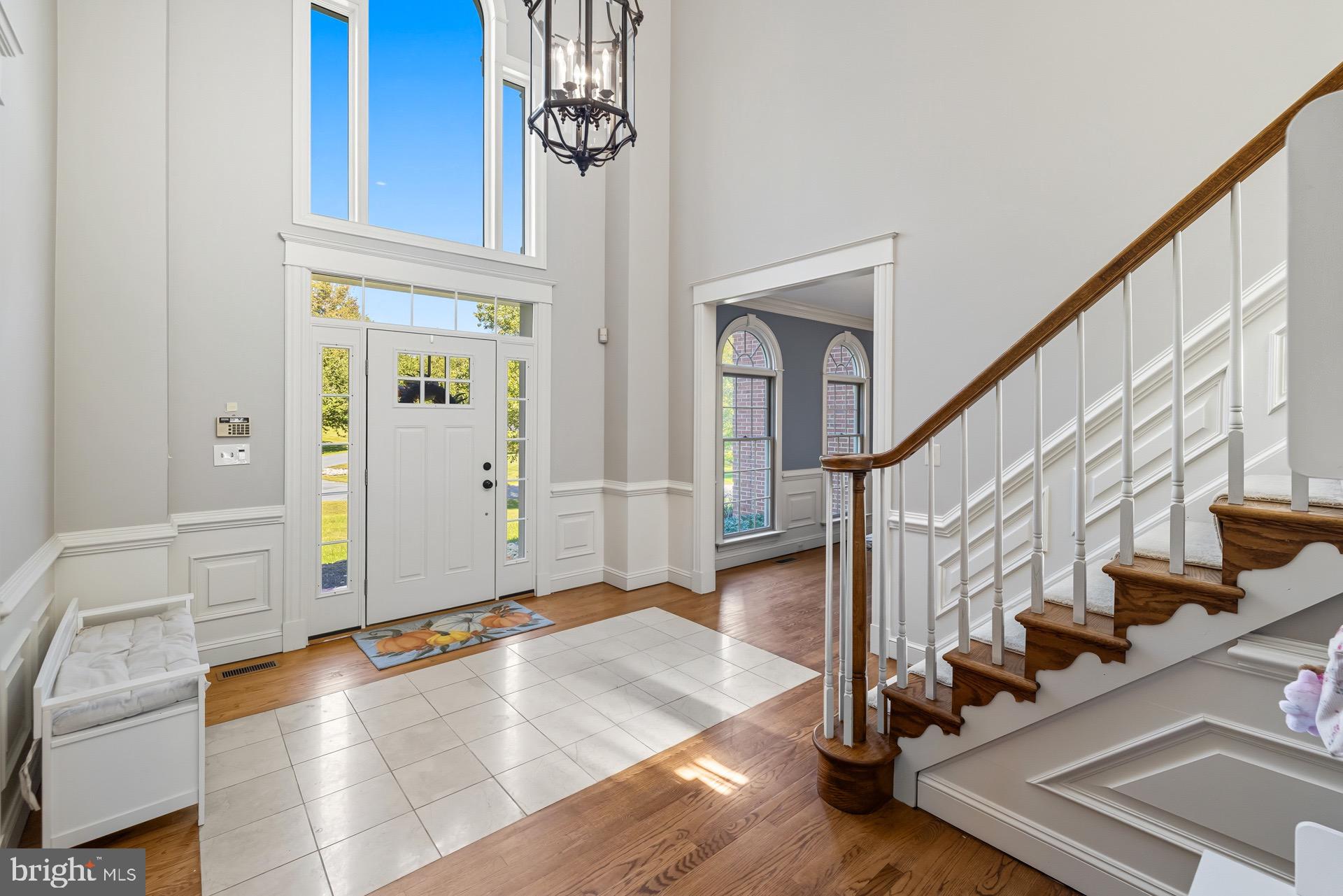 99 Hummingbird Court Dunkirk, MD 20754 - Photo 4 of 82 a view of an entryway with wooden floor and stairs