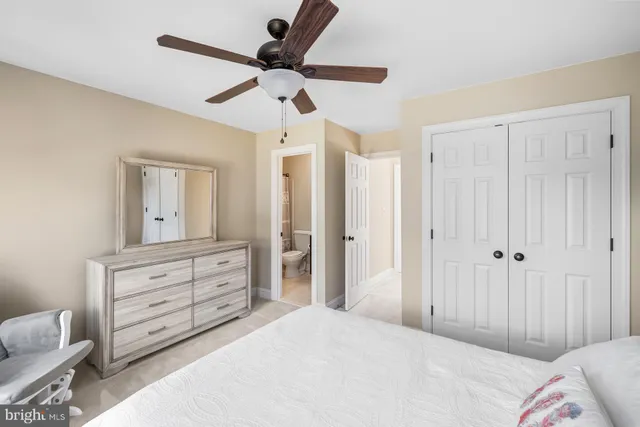 a kitchen with stainless steel appliances wooden cabinets and a refrigerator