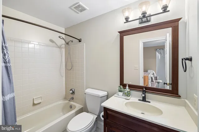 a kitchen with stainless steel appliances granite countertop wooden cabinets a sink and dishwasher