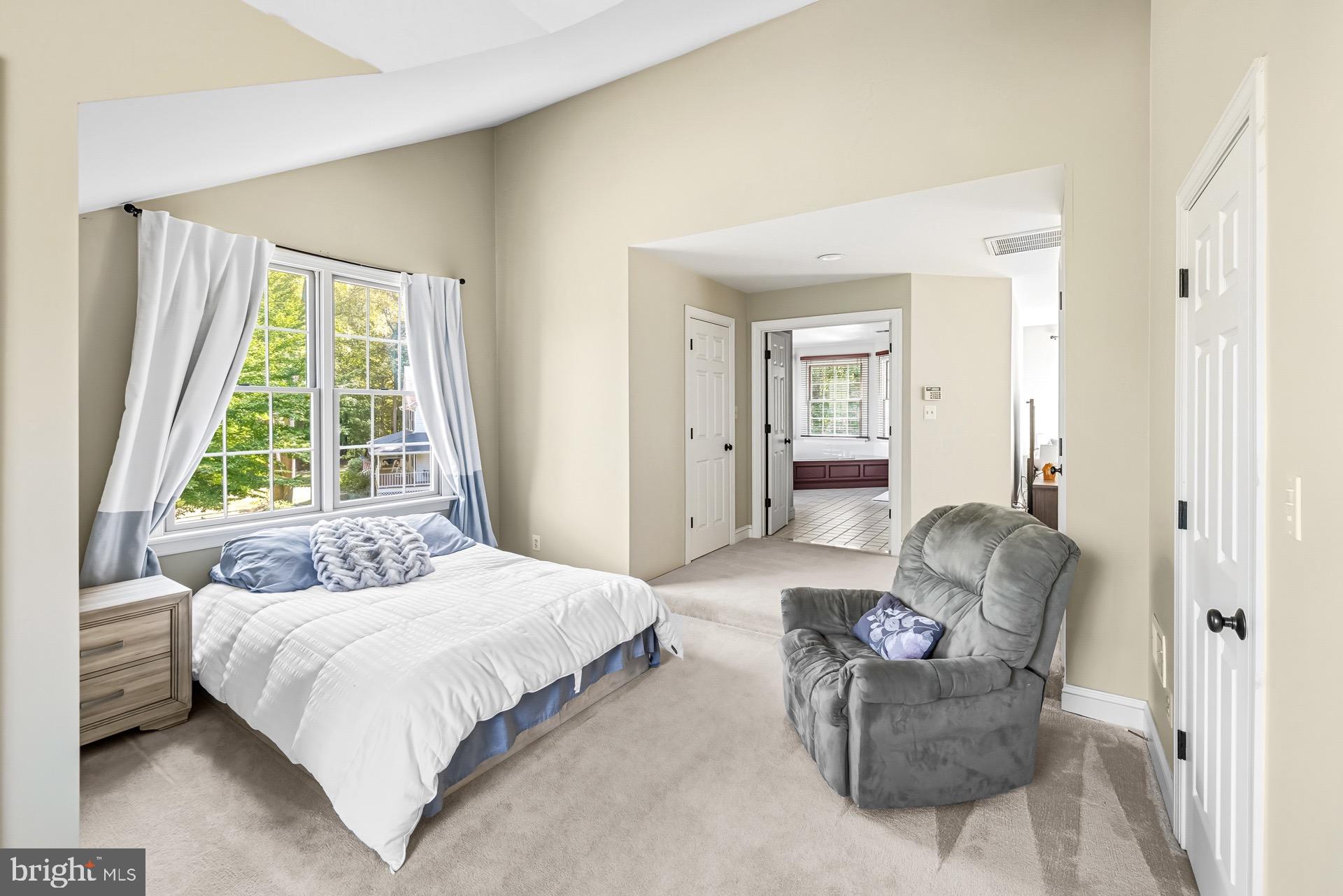 99 Hummingbird Court Dunkirk, MD 20754 - Photo 48 of 82 a bedroom with a bed and a couch next to a window