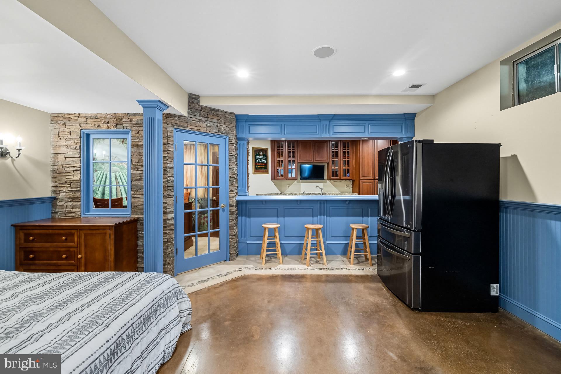 99 Hummingbird Court Dunkirk, MD 20754 - Photo 62 of 82 a kitchen with stainless steel appliances wooden cabinets and a refrigerator