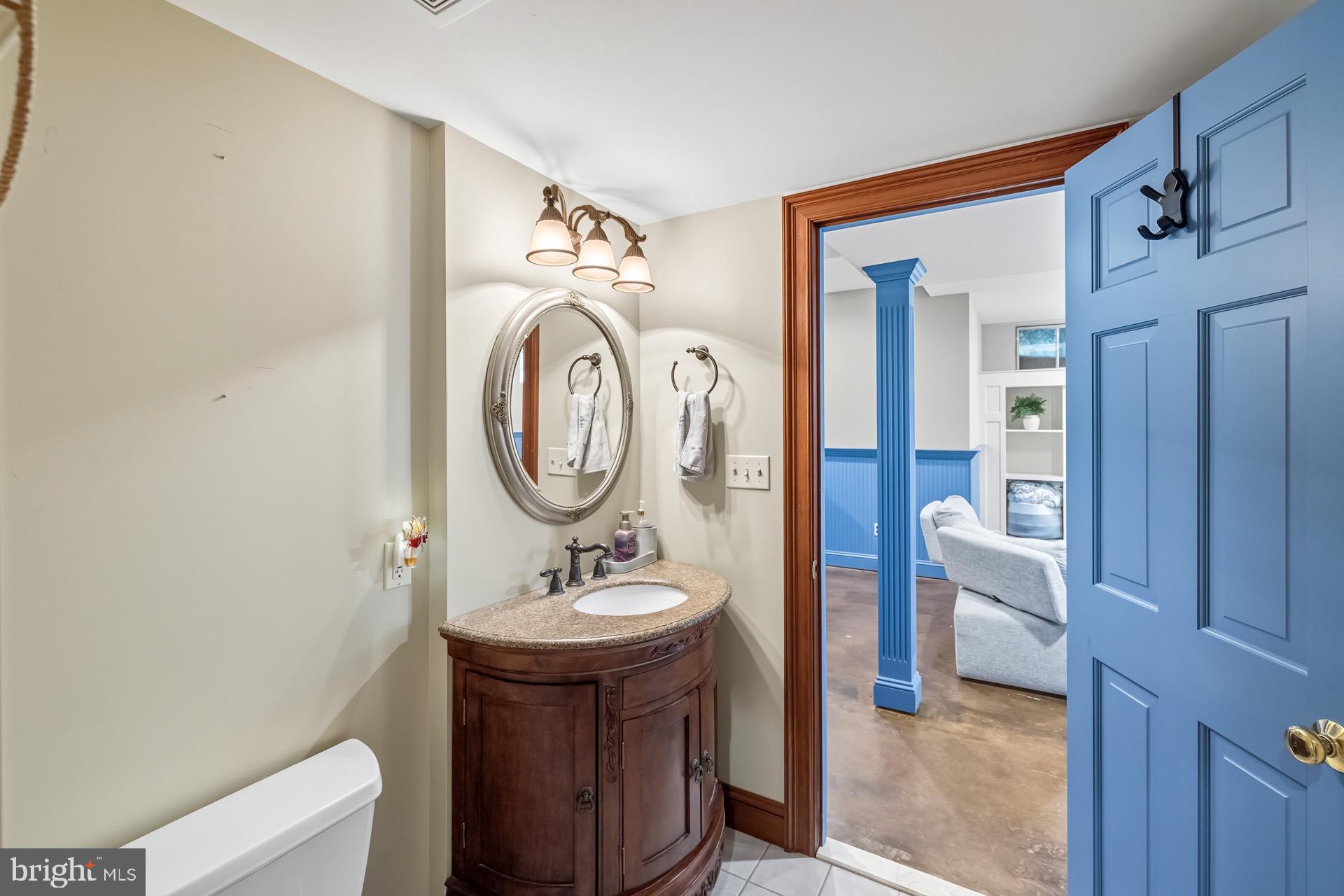 99 Hummingbird Court Dunkirk, MD 20754 - Photo 71 of 82 a bathroom with a toilet a sink and a mirror