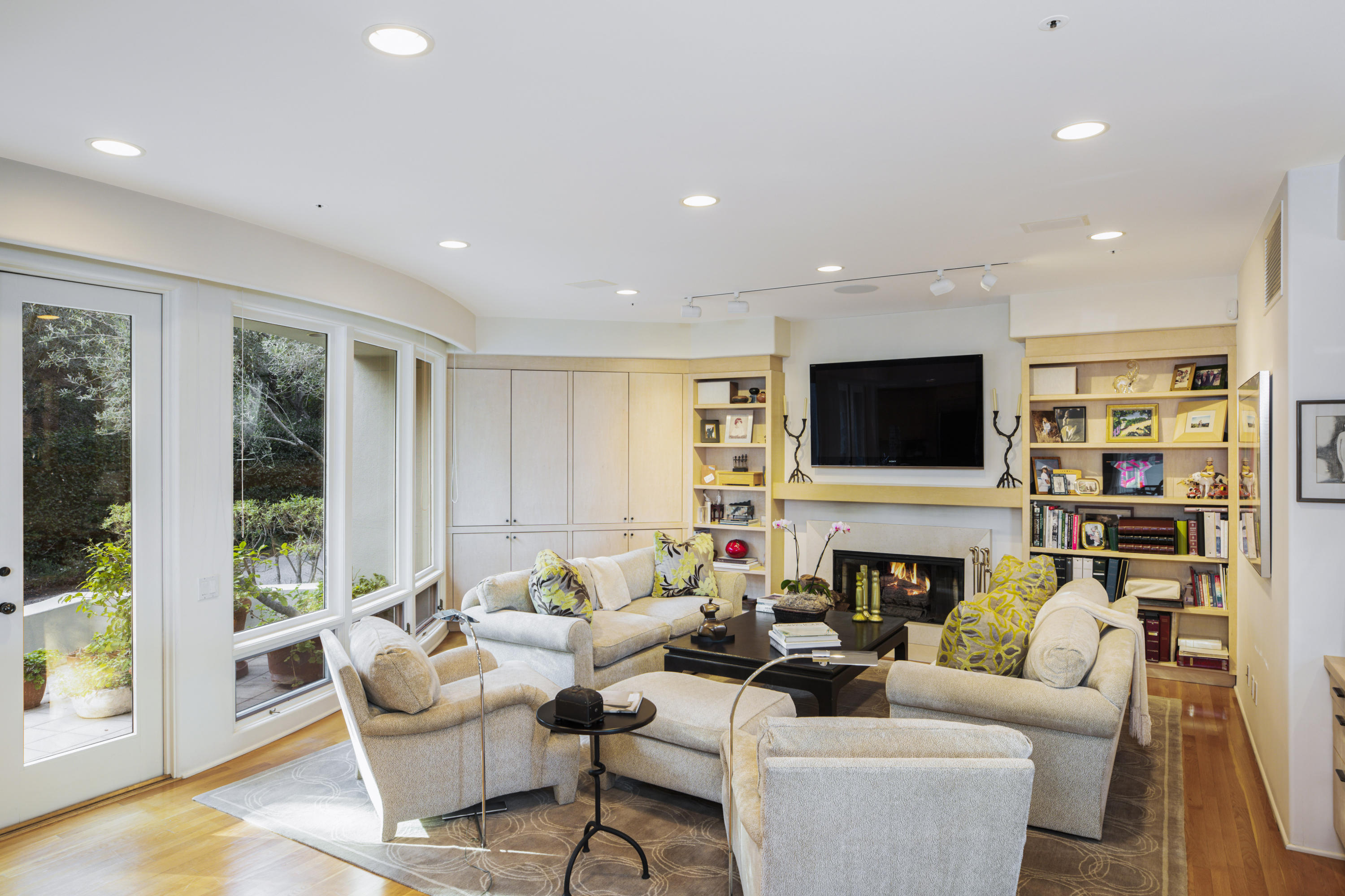 915 Park Lane Montecito, CA 93108 - Photo 11 of 33 a living room with fireplace furniture and a flat screen tv