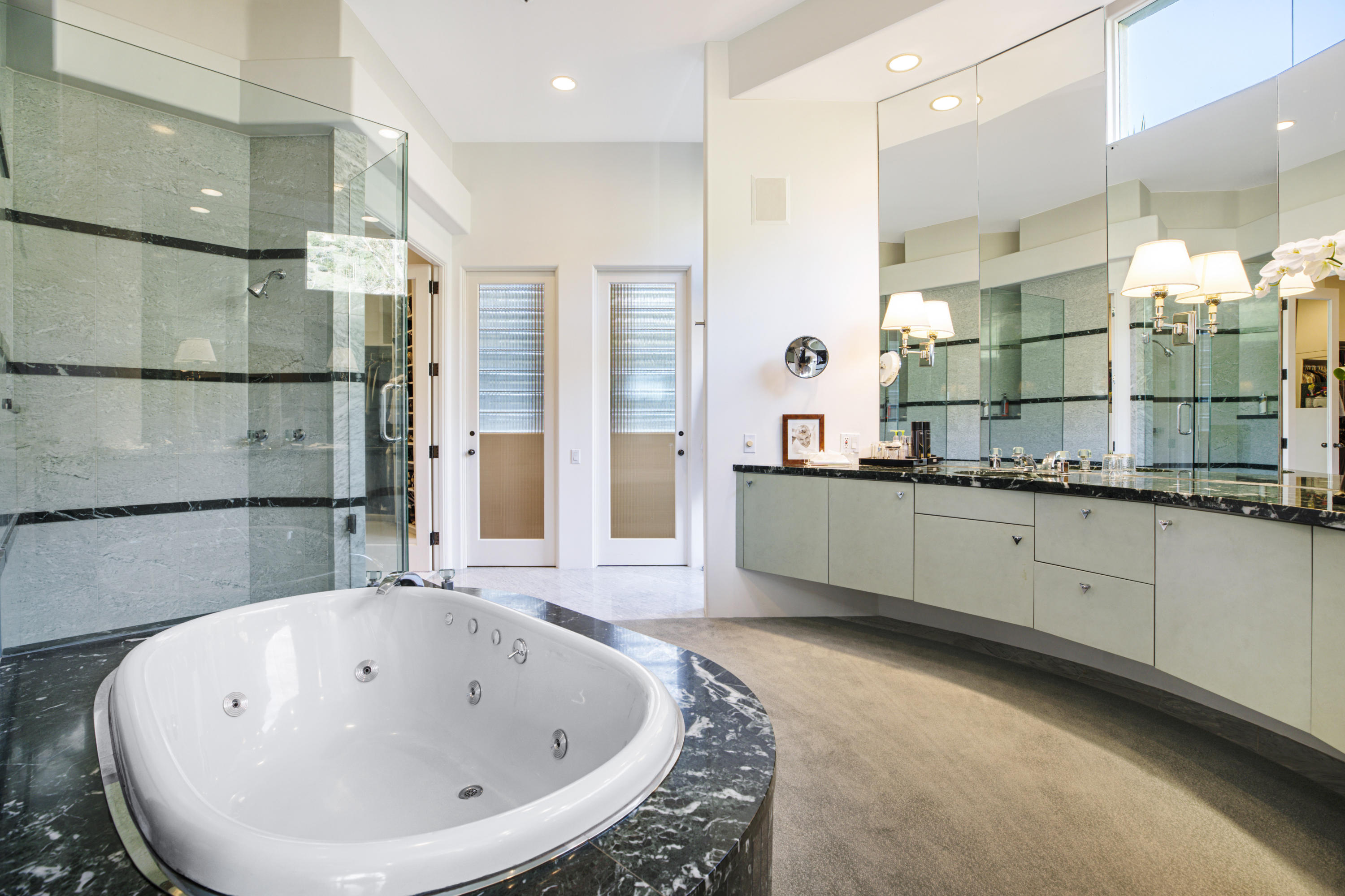915 Park Lane Montecito, CA 93108 - Photo 14 of 33 a bathroom with a bathtub sink and mirror