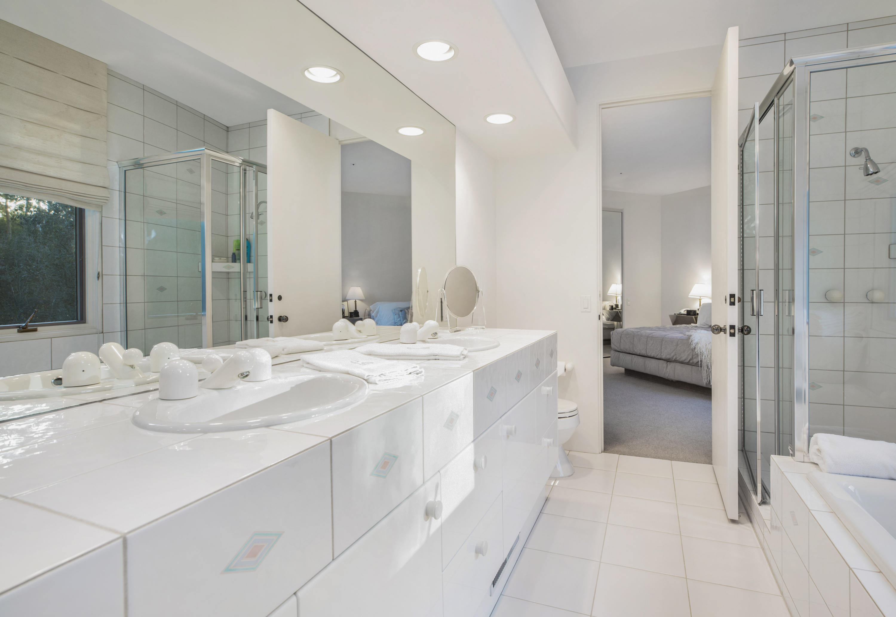 915 Park Lane Montecito, CA 93108 - Photo 17 of 33 a en suite bathroom with a double vanity sink and mirror