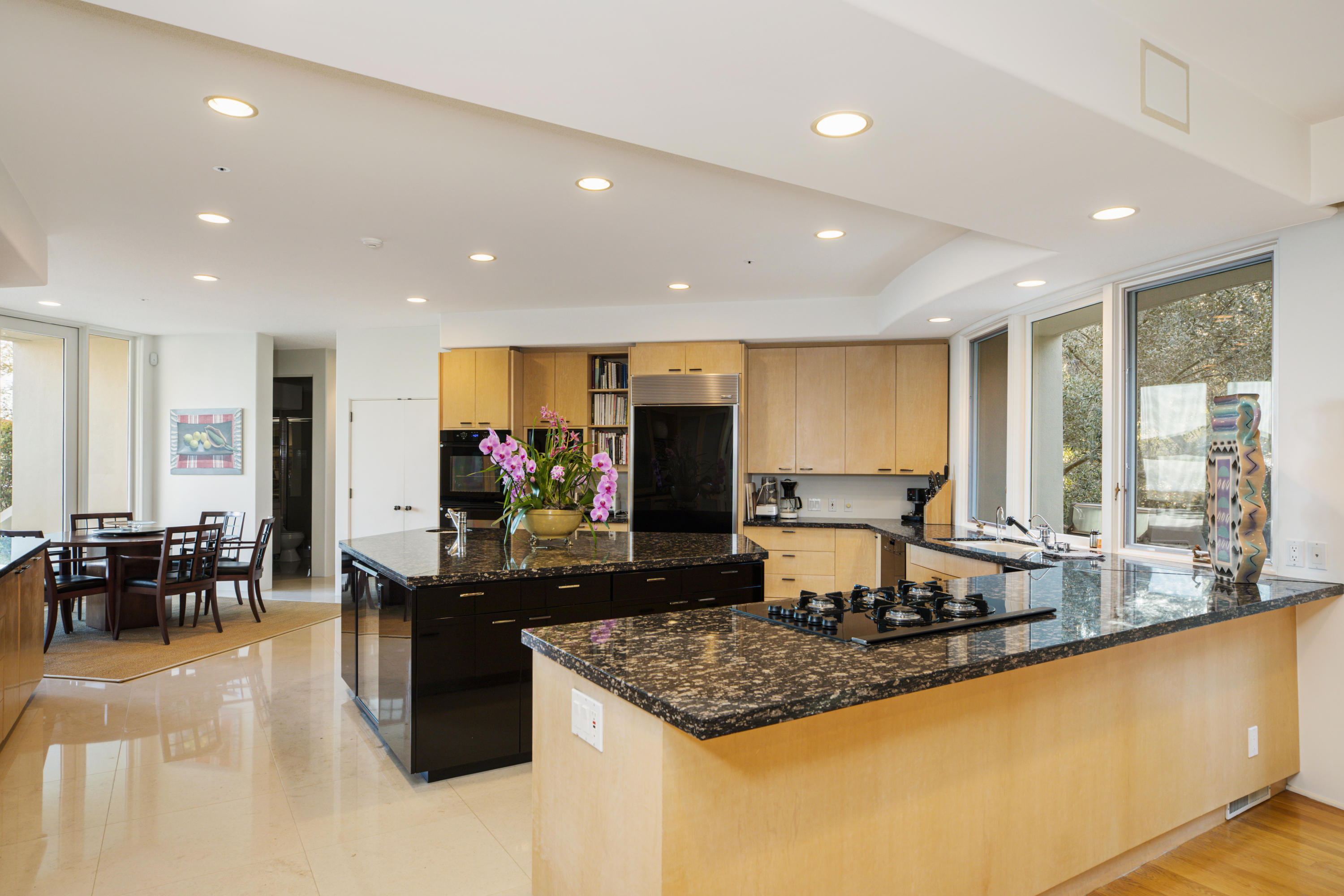 915 Park Lane Montecito, CA 93108 - Photo 9 of 33 a kitchen with kitchen island counter top space a sink appliances and a large window