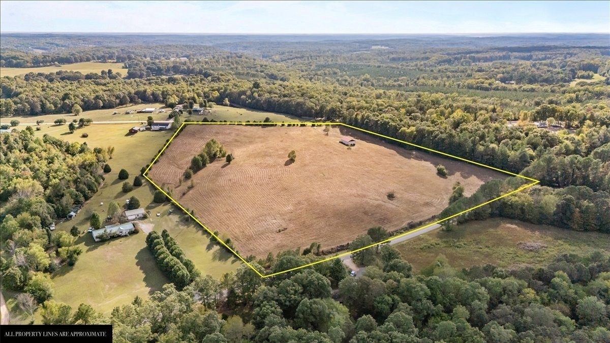 1849 Humphreys Co Line Road Dickson, TN 37055 - Photo 18 of 36 a view of a lake with a yard