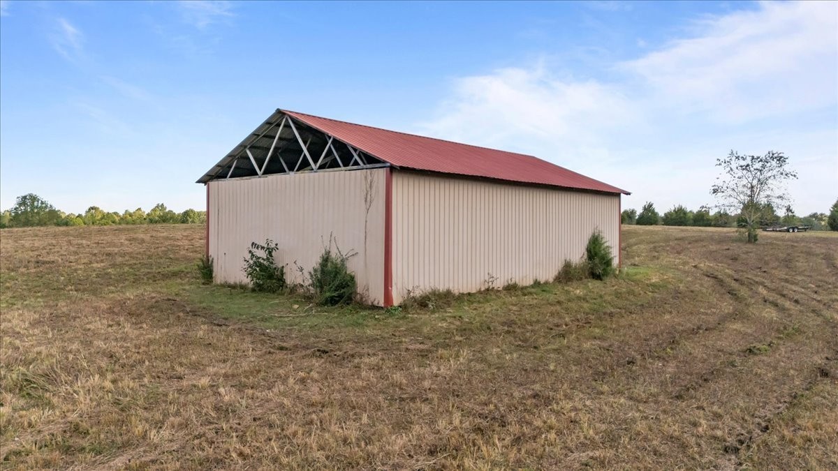 1849 Humphreys Co Line Road Dickson, TN 37055 - Photo 19 of 36 a house with trees in the background
