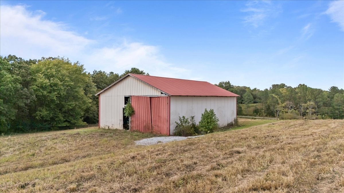 1849 Humphreys Co Line Road Dickson, TN 37055 - Photo 3 of 36 a view of a house with a yard and large tree