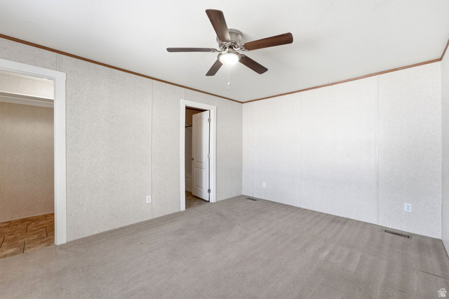 2875 North Hill Field Road, Unit 62 Layton, UT 84041 - Photo 19 of 34 Carpeted interior space with a ceiling fan featuring wood-look blades and a central light fixture
