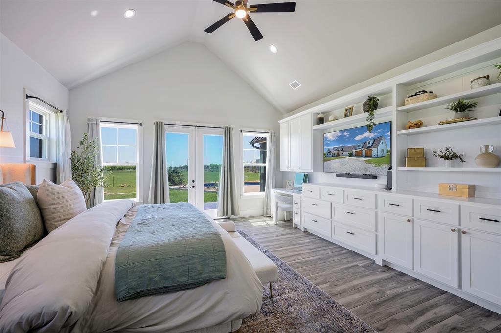 12345 Flow Road Krum, TX 76249 - Photo 16 of 38 Bedroom featuring wood finished floors, access to exterior, visible vents, a ceiling fan, and french doors