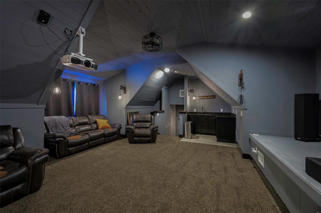 12345 Flow Road Krum, TX 76249 - Photo 26 of 38 Home theater room featuring bar, wood ceiling, carpet flooring, and vaulted ceiling