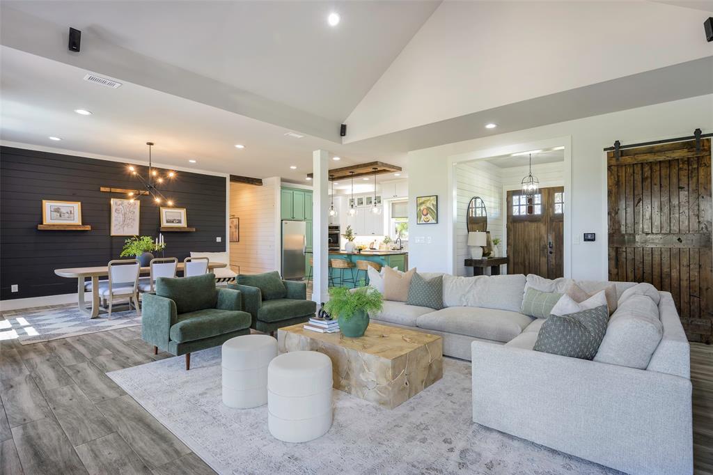 12345 Flow Road Krum, TX 76249 - Photo 6 of 38 Living area with recessed lighting, wood finished floors, a barn door, visible vents, and wooden walls