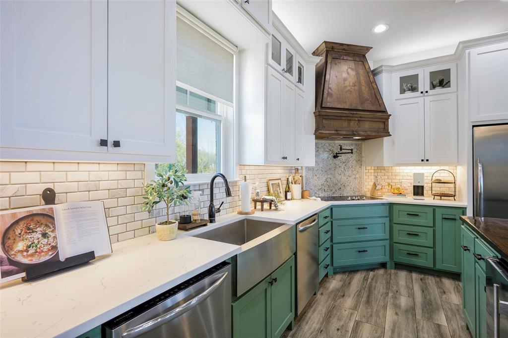 12345 Flow Road Krum, TX 76249 - Photo 9 of 38 Kitchen featuring green cabinetry, custom range hood, appliances with stainless steel finishes, and white cabinetry
