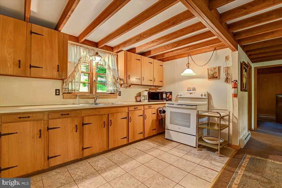 112 Beechwood Cove Road Greentown, PA 18426 - Photo 12 of 59 Charming kitchen with rustic beams.