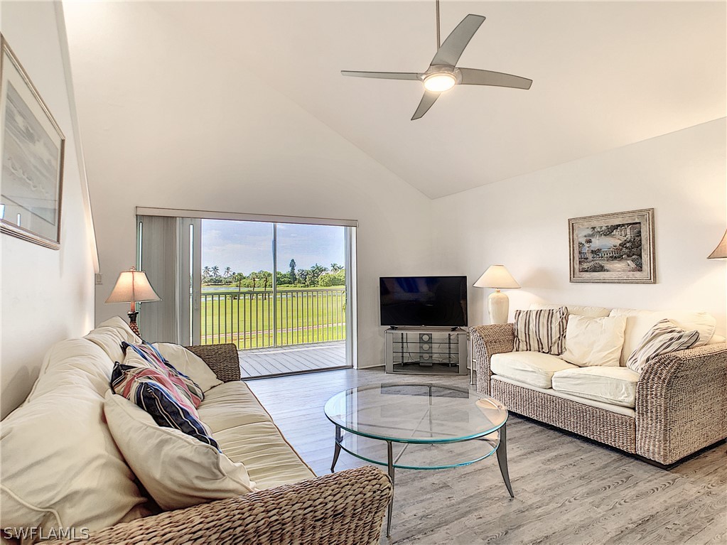 1645 Sand Castle Road Sanibel, FL 33957 - Photo 14 of 34 a living room with furniture and a flat screen tv