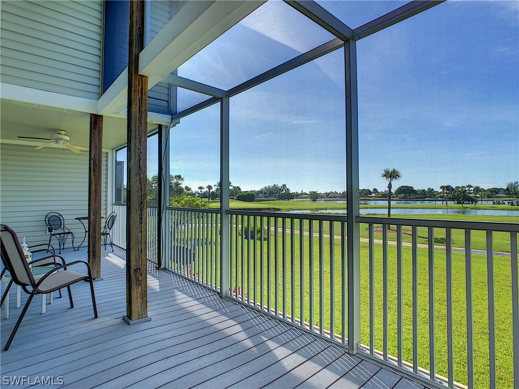 1645 Sand Castle Road Sanibel, FL 33957 - Photo 17 of 34 a view of a balcony with floor to ceiling window wooden floor and fence