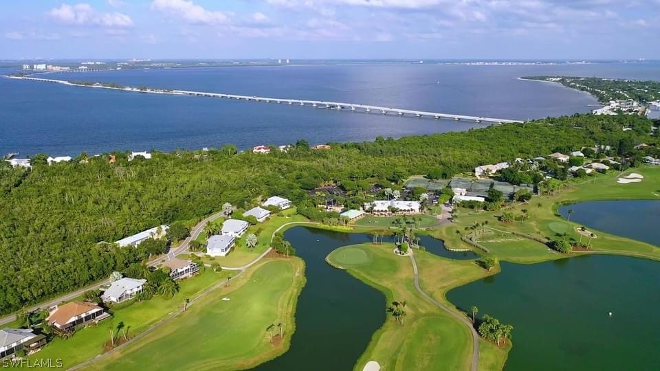 1645 Sand Castle Road Sanibel, FL 33957 - Photo 2 of 34 a view of a lake with a building in the background