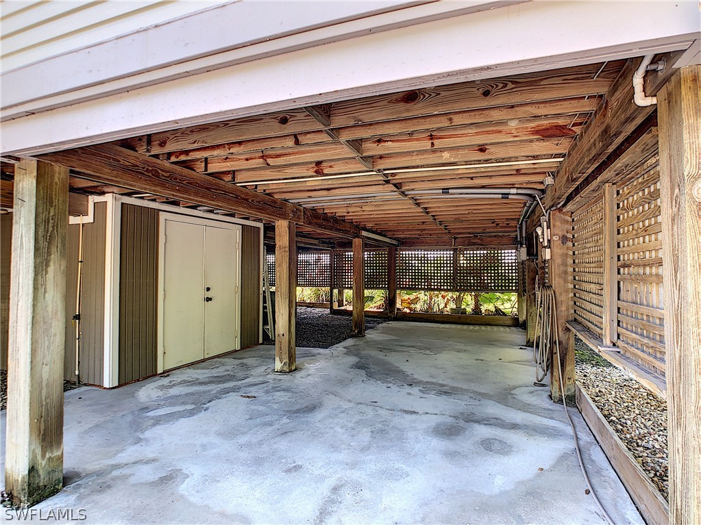 1645 Sand Castle Road Sanibel, FL 33957 - Photo 24 of 34 a view of empty room with wooden walls