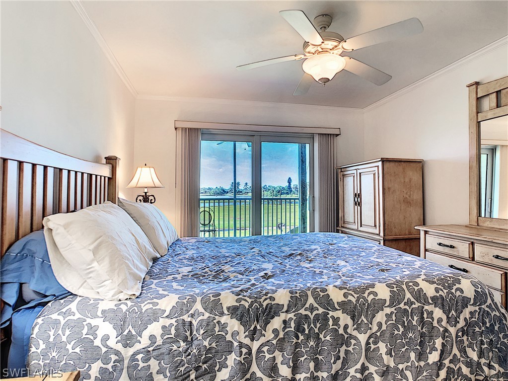 1645 Sand Castle Road Sanibel, FL 33957 - Photo 3 of 34 a bed sitting in a bedroom next to a window