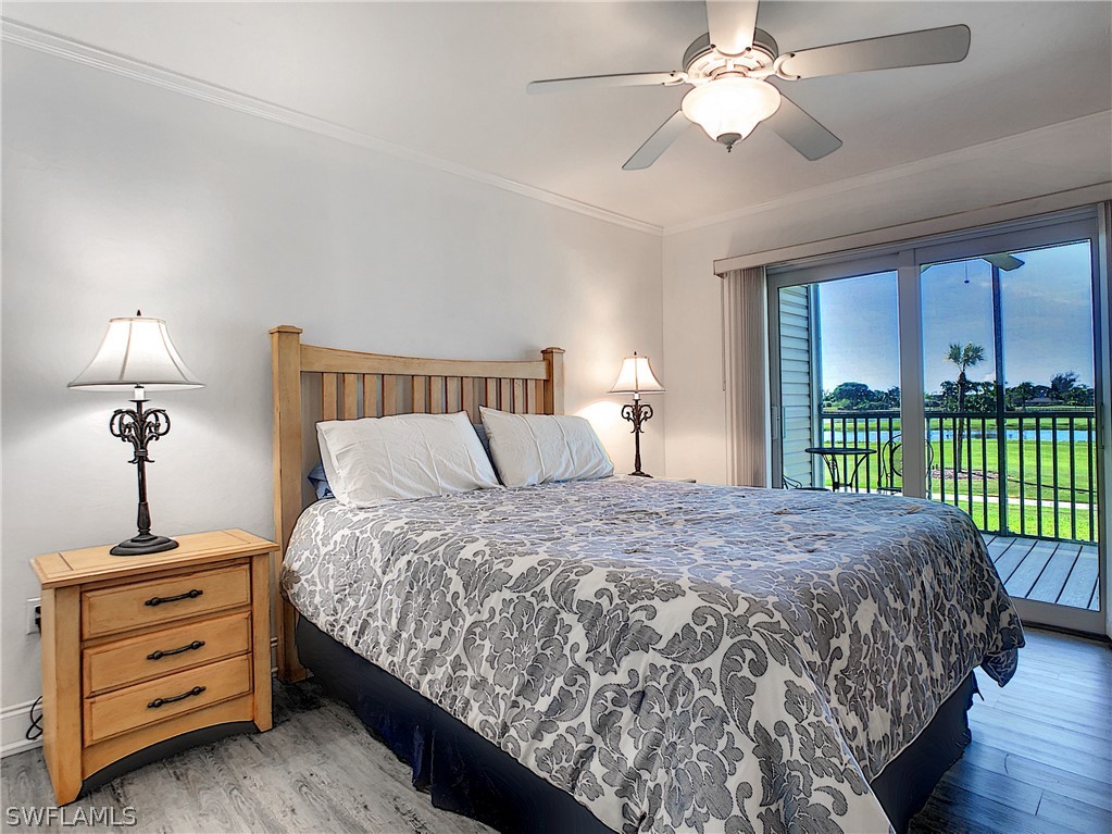 1645 Sand Castle Road Sanibel, FL 33957 - Photo 4 of 34 a bed sitting in a bedroom next to a window