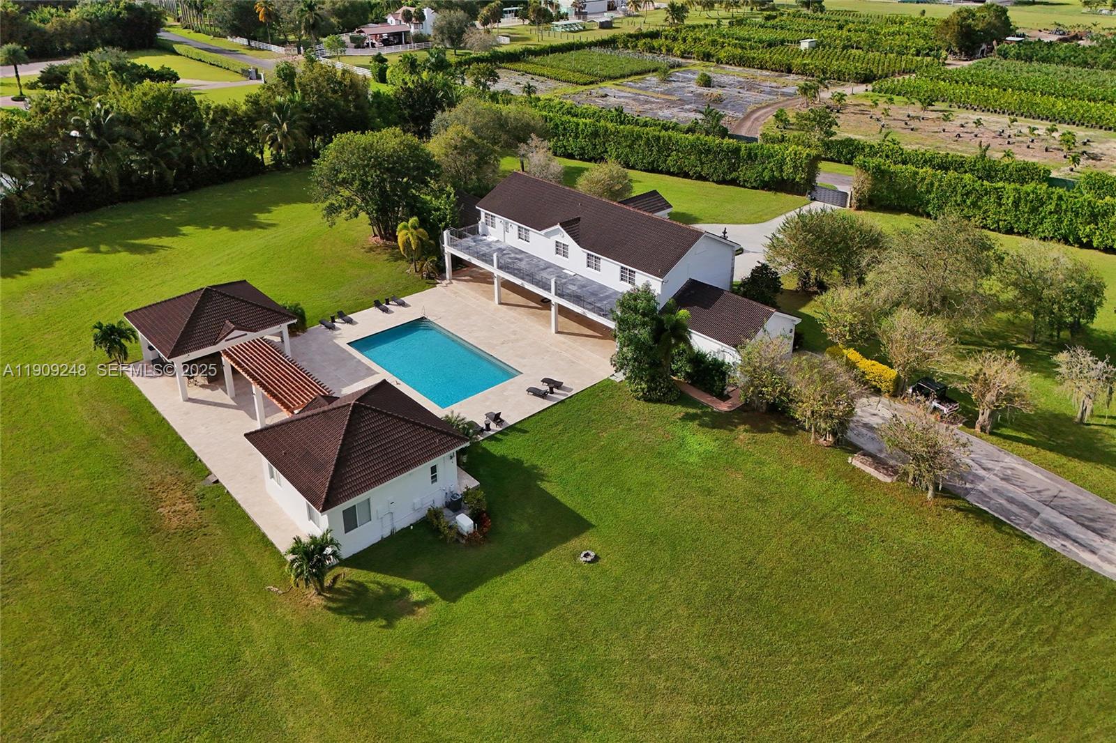 18300 Southwest 158th Street Miami, FL 33187 - Photo 32 of 100 an aerial view of a house with a garden