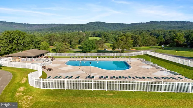 a view of a swimming pool with a lake view