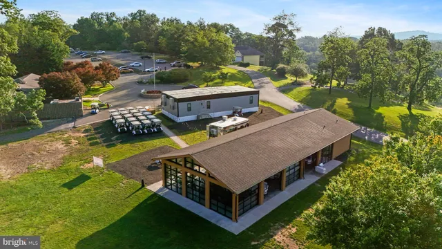 an aerial view of a house with a garden