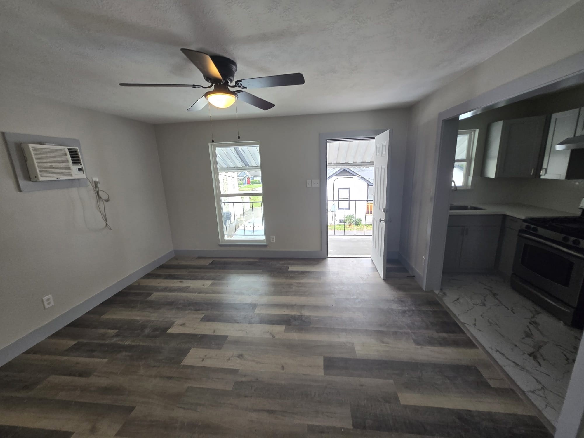 8335 Bonner Drive, Unit 2 Houston, TX 77017 - Photo 3 of 10 a view of an empty room with window and wooden floor