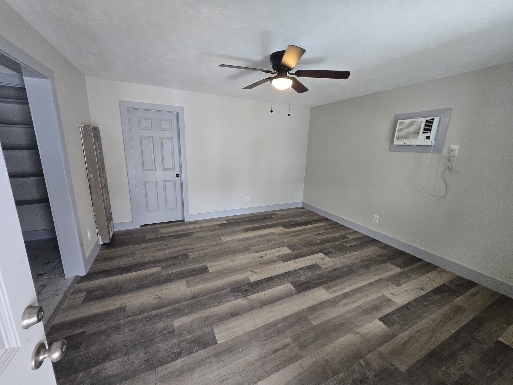 8335 Bonner Drive, Unit 2 Houston, TX 77017 - Photo 5 of 10 a view of a room with wooden floor and white walls