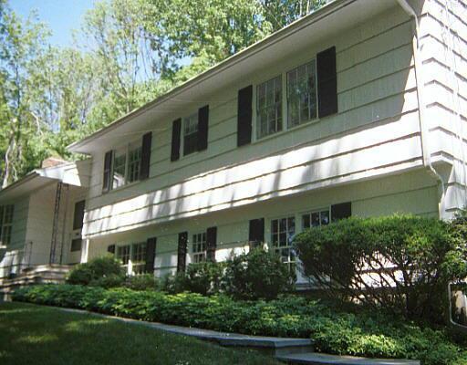 33 Parish Road New Canaan, CT 06840 - Photo 1 of 1 a front view of a house with garden