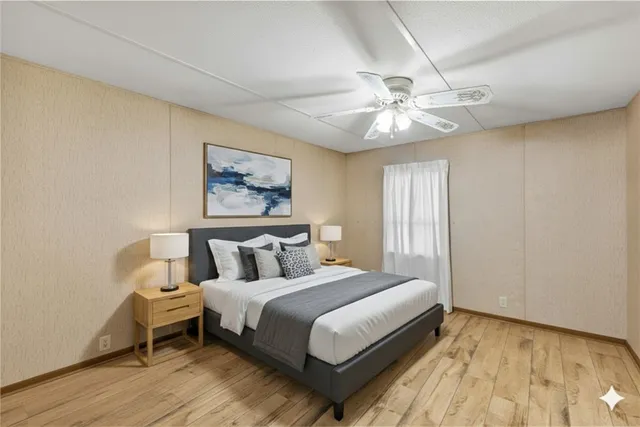 a bathroom with a sink vanity mirror and toilet