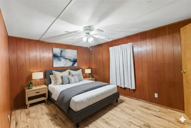a kitchen with cabinets and wooden floor