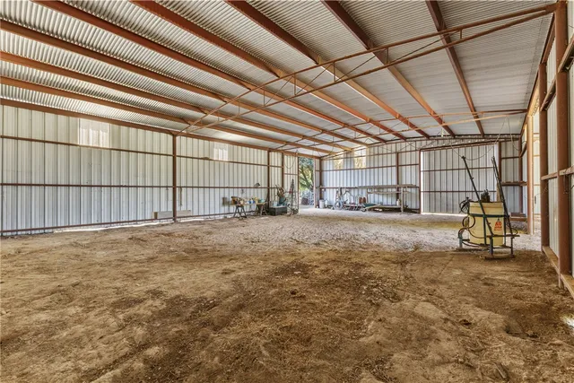 a view of a house with backyard and porch