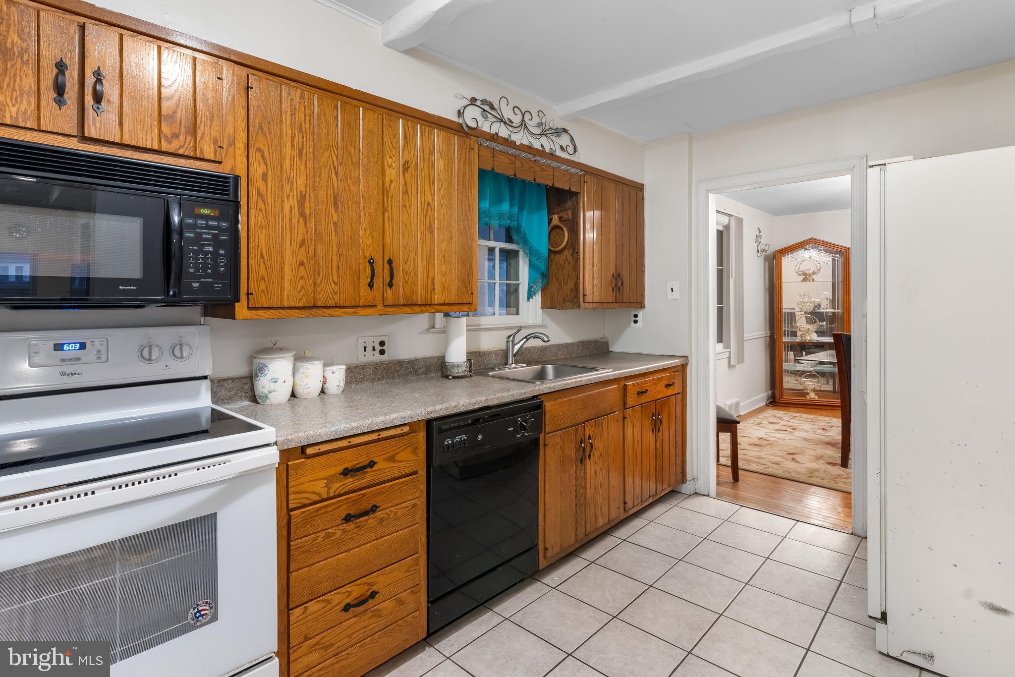 38 Johns Road Cheltenham, PA 19012 - Photo 15 of 52 a kitchen with stainless steel appliances granite countertop a stove a sink and a microwave