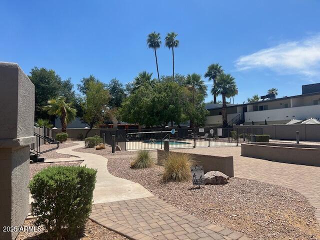 810 East Colter Street, Unit 11 Phoenix, AZ 85014 - Photo 16 of 17 a view of a swimming pool with chairs
