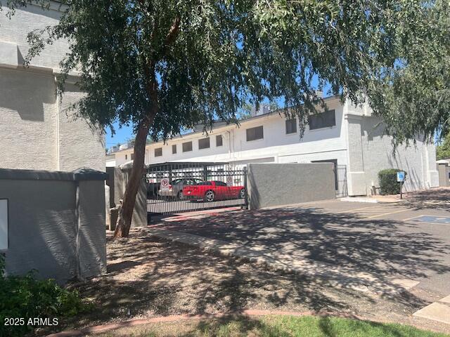 810 East Colter Street, Unit 11 Phoenix, AZ 85014 - Photo 17 of 17 a view of a white house with a large tree
