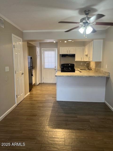 810 East Colter Street, Unit 11 Phoenix, AZ 85014 - Photo 2 of 17 a large kitchen with kitchen island a sink stainless steel appliances and cabinets