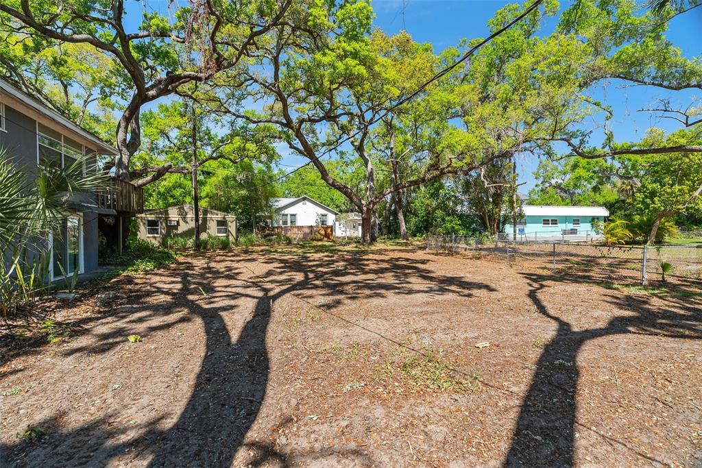 300 President Street Dunedin, FL 34698 - Photo 11 of 53 a view of a backyard with large trees