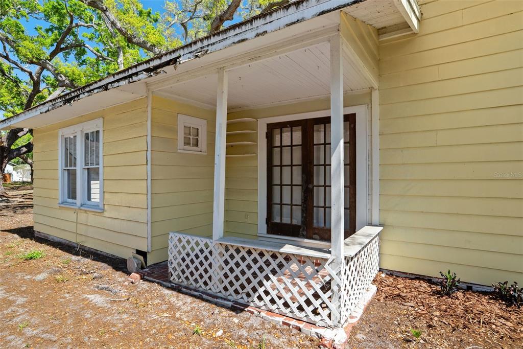 300 President Street Dunedin, FL 34698 - Photo 15 of 53 a view of a wooden door and chair