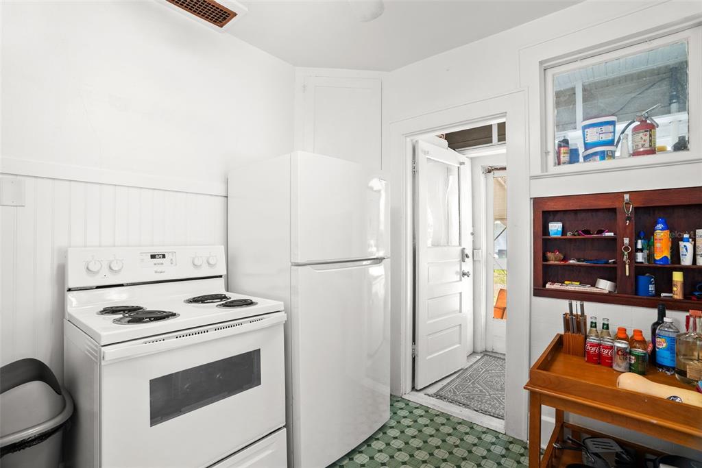 300 President Street Dunedin, FL 34698 - Photo 16 of 53 a kitchen with stainless steel appliances a refrigerator sink and cabinets